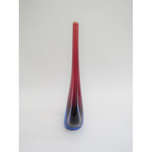 9157 - A Murano glass slender vase in red and blue encased in clear with 'fin' sides. 27.5cm high