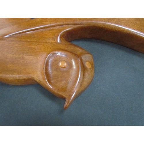 9417 - A teak wall hanging of a Barn Owl in flight. Marked 'K' verso. 35cm tall x 59cm wide