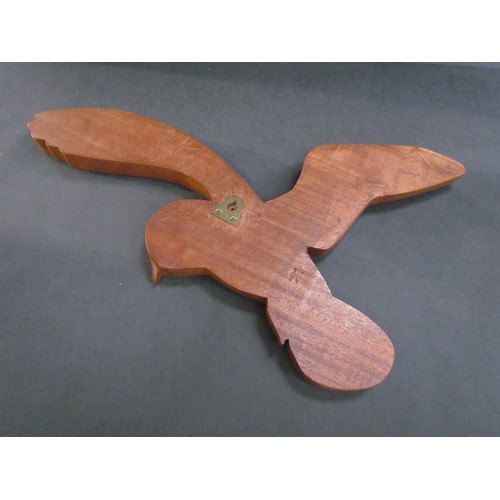 9417 - A teak wall hanging of a Barn Owl in flight. Marked 'K' verso. 35cm tall x 59cm wide