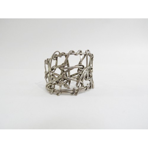 9232 - A 1960's white metal abstract statement cuff bangle