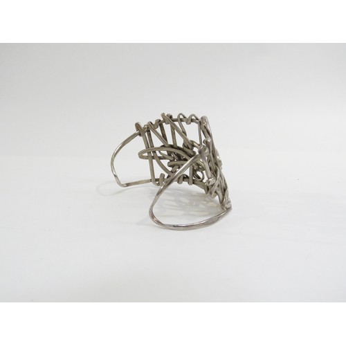 9232 - A 1960's white metal abstract statement cuff bangle