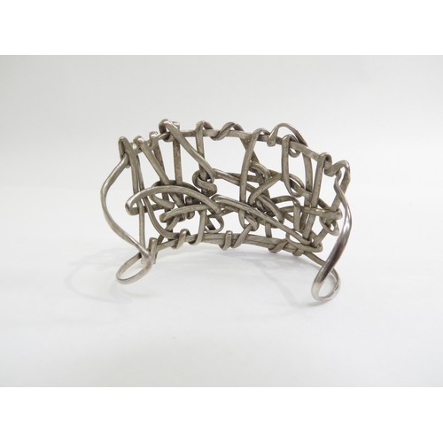 9232 - A 1960's white metal abstract statement cuff bangle