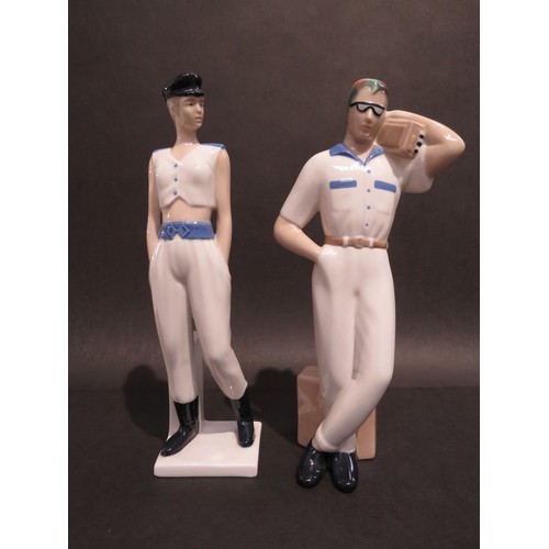 9072 - A pair of Spanish porcelain figures by Miquel Requenna, male with rainbow hair, glasses and a Ghetto... 