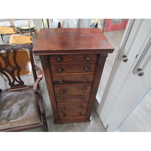 6086 - A 19th Century mahogany wellington chest of seven graduating drawers (one handle damaged), key with ... 