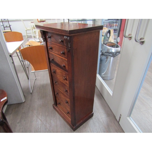 6086 - A 19th Century mahogany wellington chest of seven graduating drawers (one handle damaged), key with ... 