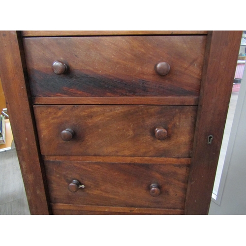 6086 - A 19th Century mahogany wellington chest of seven graduating drawers (one handle damaged), key with ... 