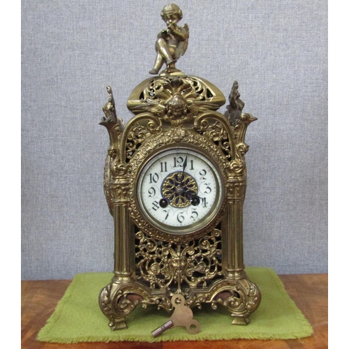 6090 - An ornate brass pierced case mantel clock with F. Marti Laine Paris cylinder movement , striking on ... 