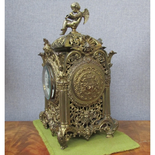 6090 - An ornate brass pierced case mantel clock with F. Marti Laine Paris cylinder movement , striking on ... 