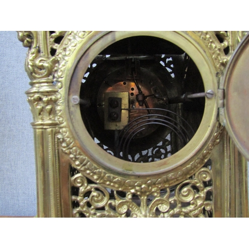 6090 - An ornate brass pierced case mantel clock with F. Marti Laine Paris cylinder movement , striking on ... 