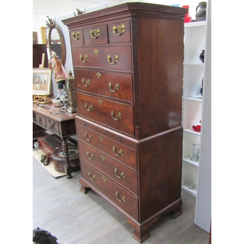 6092 - A Georgian mahogany chest on chest, three small drawers over three long graduating drawers to top an... 