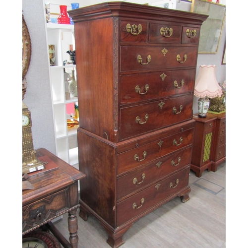 6092 - A Georgian mahogany chest on chest, three small drawers over three long graduating drawers to top an... 