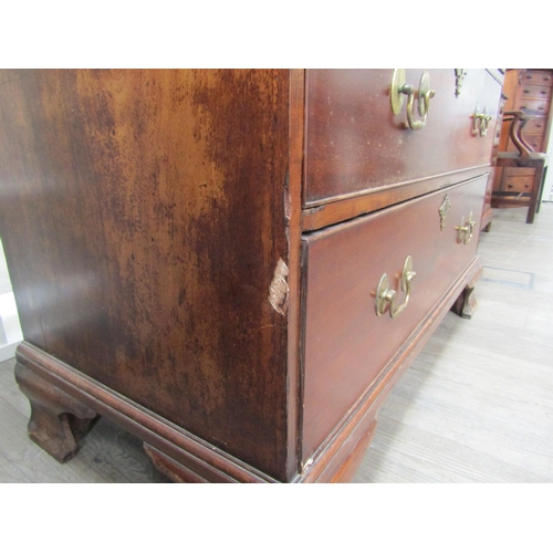 6092 - A Georgian mahogany chest on chest, three small drawers over three long graduating drawers to top an... 