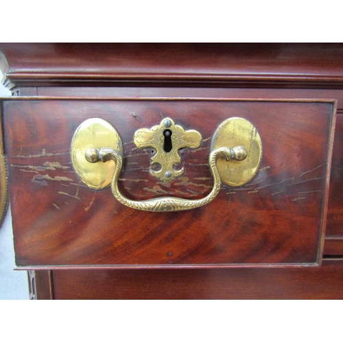 6092 - A Georgian mahogany chest on chest, three small drawers over three long graduating drawers to top an... 