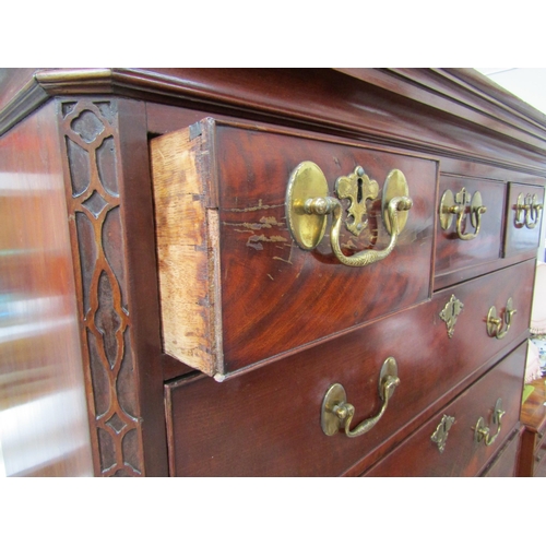 6092 - A Georgian mahogany chest on chest, three small drawers over three long graduating drawers to top an... 