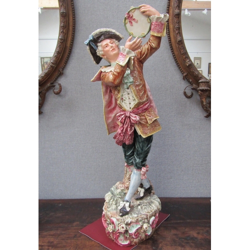 6096 - An early 20th Century ceramic figure of a gent with tambourine, 78cm height