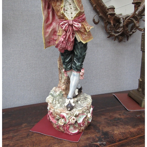6096 - An early 20th Century ceramic figure of a gent with tambourine, 78cm height