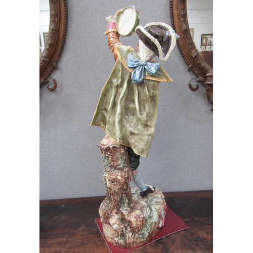 6096 - An early 20th Century ceramic figure of a gent with tambourine, 78cm height