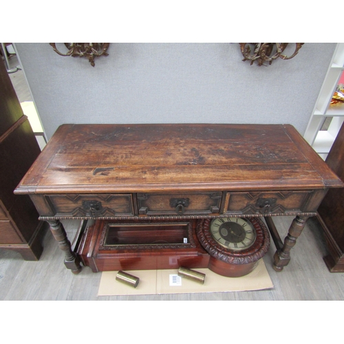 6098 - A 19th Century Jacobean style oak three drawer sideboard with heavy wrought iron handles (moulding m... 