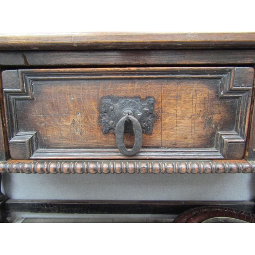 6098 - A 19th Century Jacobean style oak three drawer sideboard with heavy wrought iron handles (moulding m... 