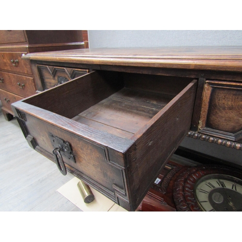 6098 - A 19th Century Jacobean style oak three drawer sideboard with heavy wrought iron handles (moulding m... 