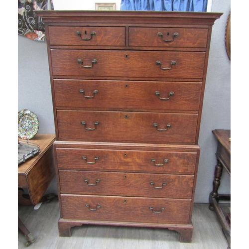 6101 - A Georgian oak chest on chest, two small over three long graduating drawers to top and three graduat... 