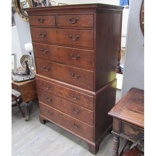 6101 - A Georgian oak chest on chest, two small over three long graduating drawers to top and three graduat... 