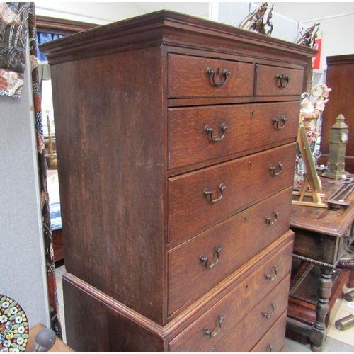 6101 - A Georgian oak chest on chest, two small over three long graduating drawers to top and three graduat... 