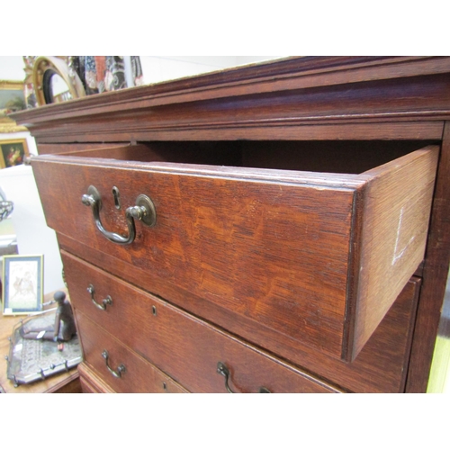 6101 - A Georgian oak chest on chest, two small over three long graduating drawers to top and three graduat... 