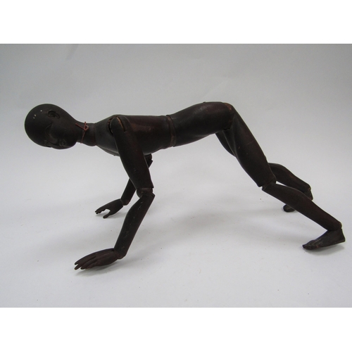 6104 - A 19th Century carved and stained pine artist's lay figure, articulated limbs, 49cm long