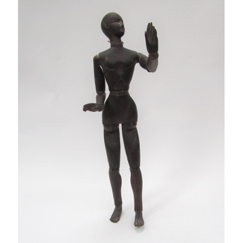 6104 - A 19th Century carved and stained pine artist's lay figure, articulated limbs, 49cm long
