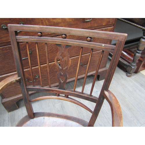6107 - A Mendlesham elm and mahogany stick-back elbow chair on turned legs with an 