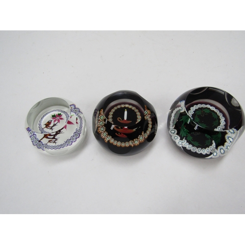 6112 - Three Caithness Christmas paperweights; 1981 'Robin' 299/500, 1979 'Holly Wreath' 51/500 and 1977 15... 