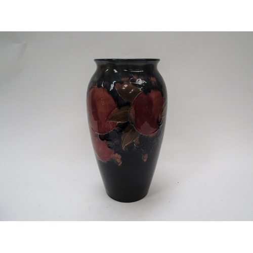 6117 - A William Moorcroft pomegranate vase, 25cm tall