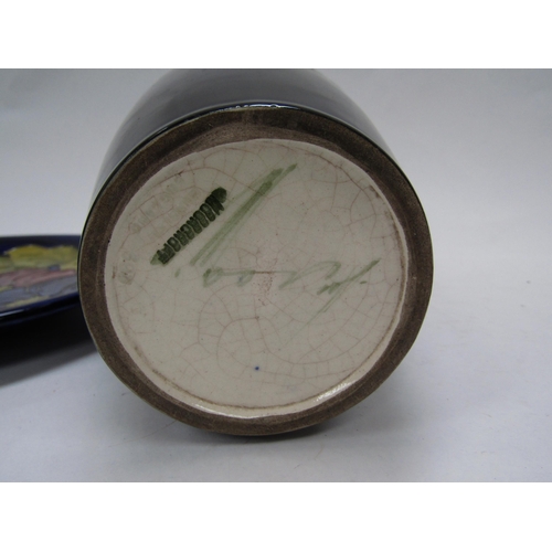 6117 - A William Moorcroft pomegranate vase, 25cm tall