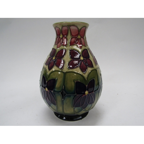 6120 - A Moorcroft Violet pattern vase, 19cm tall