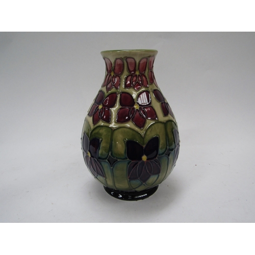 6120 - A Moorcroft Violet pattern vase, 19cm tall