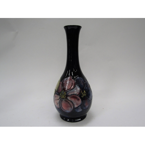 6121 - A Moorcroft Clematis pattern vase with slender neck, 26.5cm tall