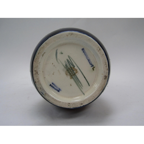 6121 - A Moorcroft Clematis pattern vase with slender neck, 26.5cm tall