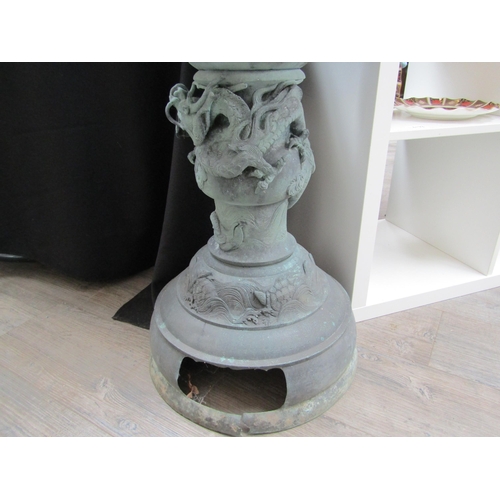 6126 - A bronze Chinese floor standing incense burner with dragon high relief detail on domed footed base, ... 