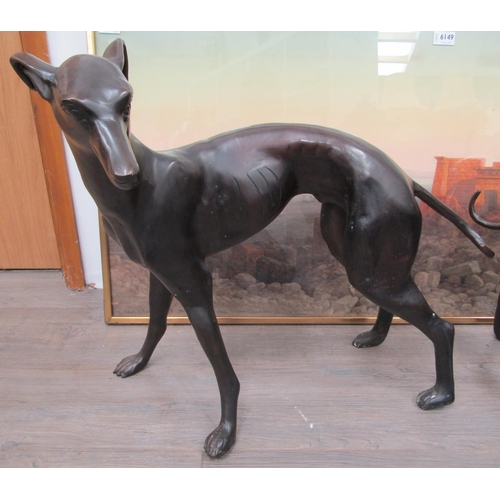 6127 - A pair of hollow cast bronze whippets or greyhounds, unsigned, both approximately 53cm x 67cm