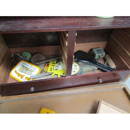6129 - A watch repairers travelling cabinet with horological tools and parts