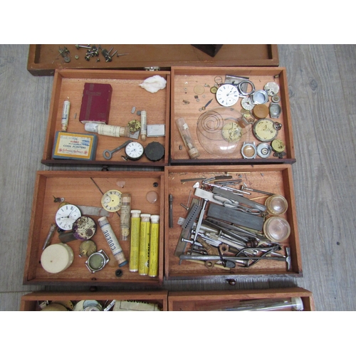 6129 - A watch repairers travelling cabinet with horological tools and parts