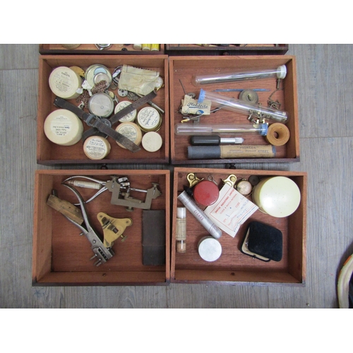 6129 - A watch repairers travelling cabinet with horological tools and parts