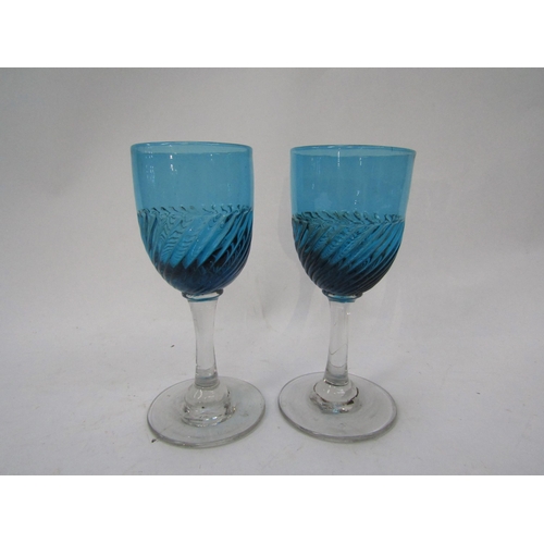 6160 - A set of six Victorian blue wine/sherry glasses, the bowls with wrythen lower halves, clear stems an... 