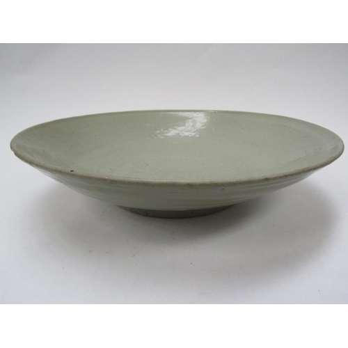 6175 - Ming Dynasty (1368-1644) Chinese celadon bowl with incised leaping horse detail, chips to the rim an... 