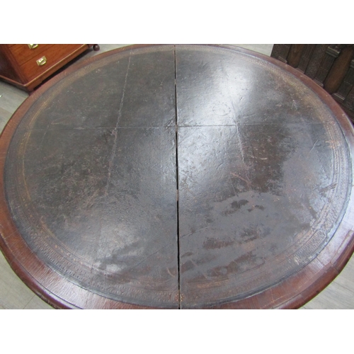 6177A - A Victorian drum/rent table, with original skiver over four frieze drawers and four dummy drawers on... 