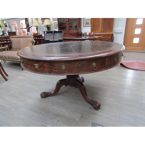 6177A - A Victorian drum/rent table, with original skiver over four frieze drawers and four dummy drawers on... 