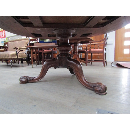 6177A - A Victorian drum/rent table, with original skiver over four frieze drawers and four dummy drawers on... 