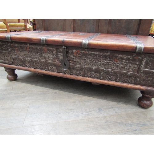 6180 - An Indian hardwood coffee table with storage compartment to the interior, metal strapping and panel ... 