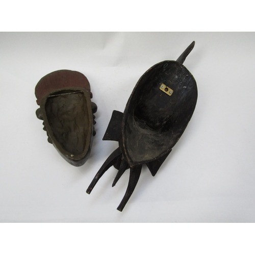 6186 - Two African masks, one wood, one pottery, 49cm & 34cm long